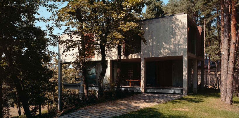 concrete columns lift residence above forested terrain in georgia
