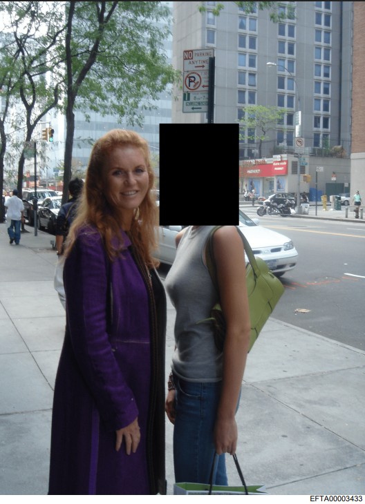 Sarah Ferguson smiling with a young woman on a city street.