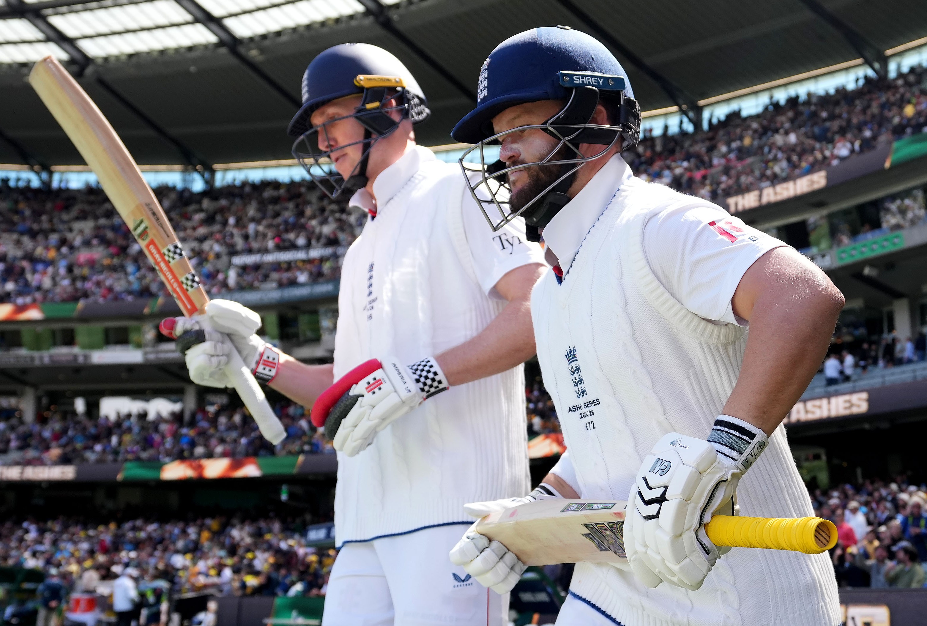 England’s Ben Duckett and Zak Crawley walk out to bat at Melbourne Cricket Ground.