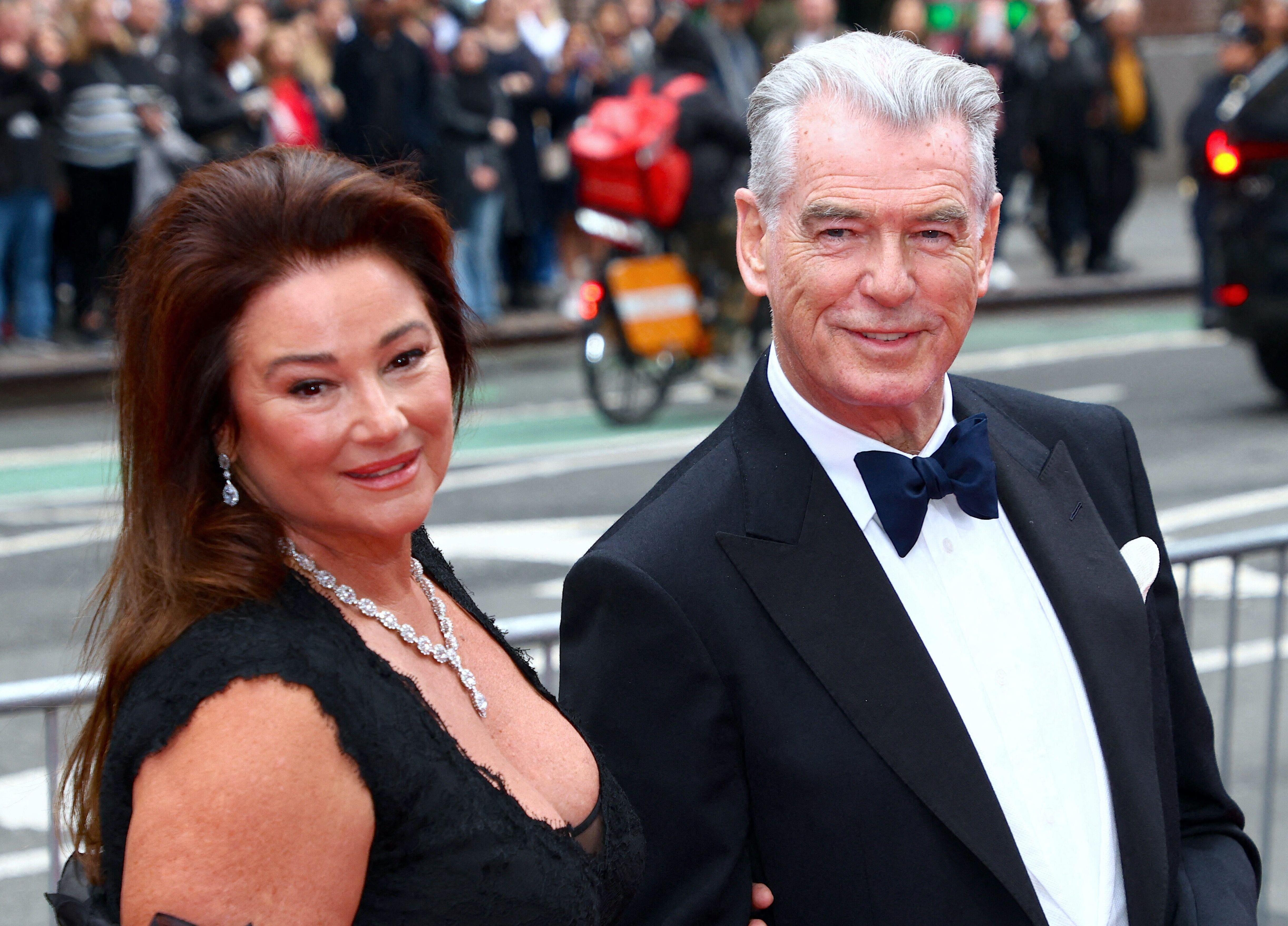 Pierce Brosnan in a tuxedo and his wife in a black dress attending the opening night of "Good Night and Good Luck."