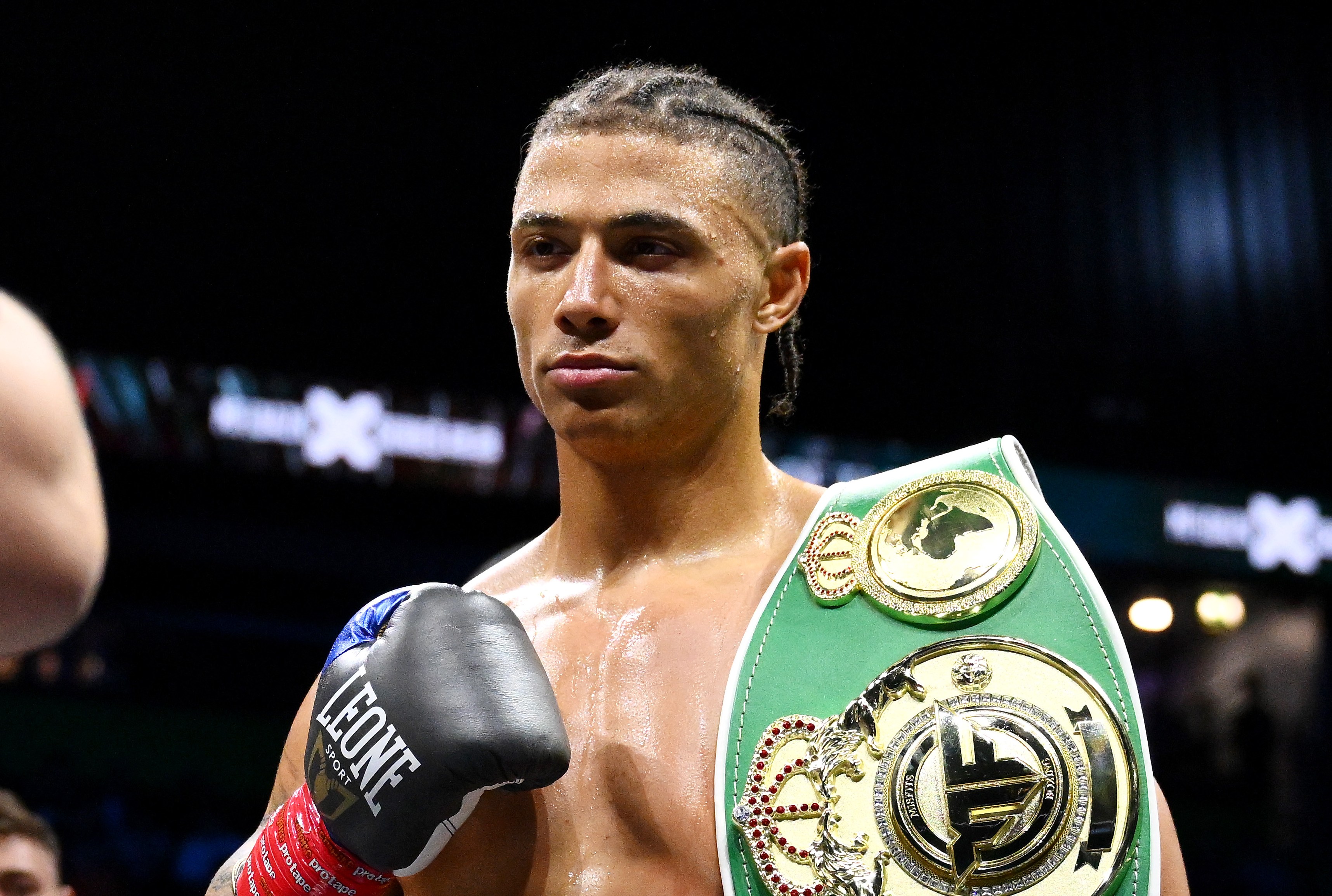Chase Demoor celebrates his victory with his Misfits heavyweight championship belt.