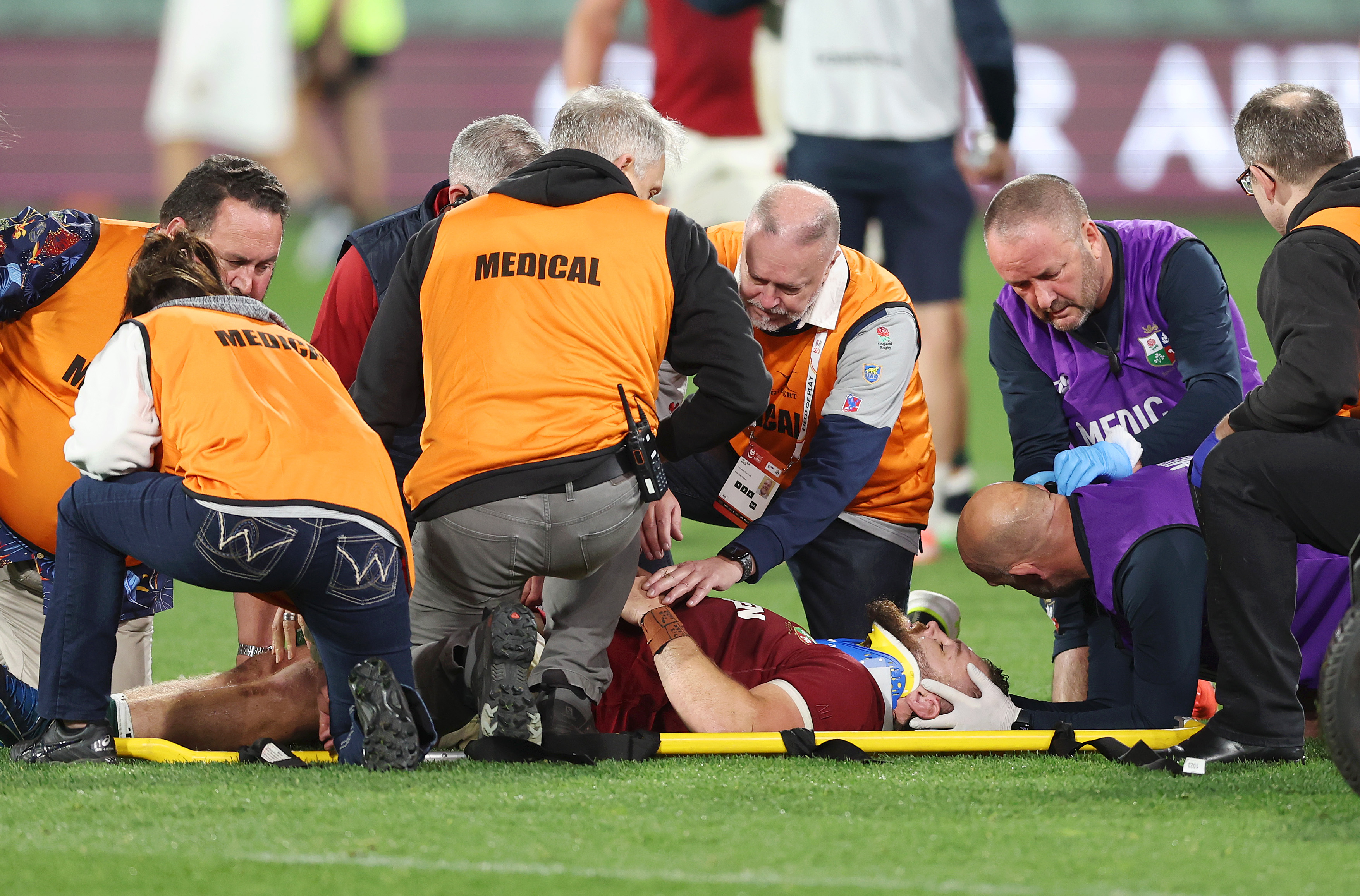 Luke Cowan-Dickie of British & Irish Lions receives medical treatment and is stretchered off the field.