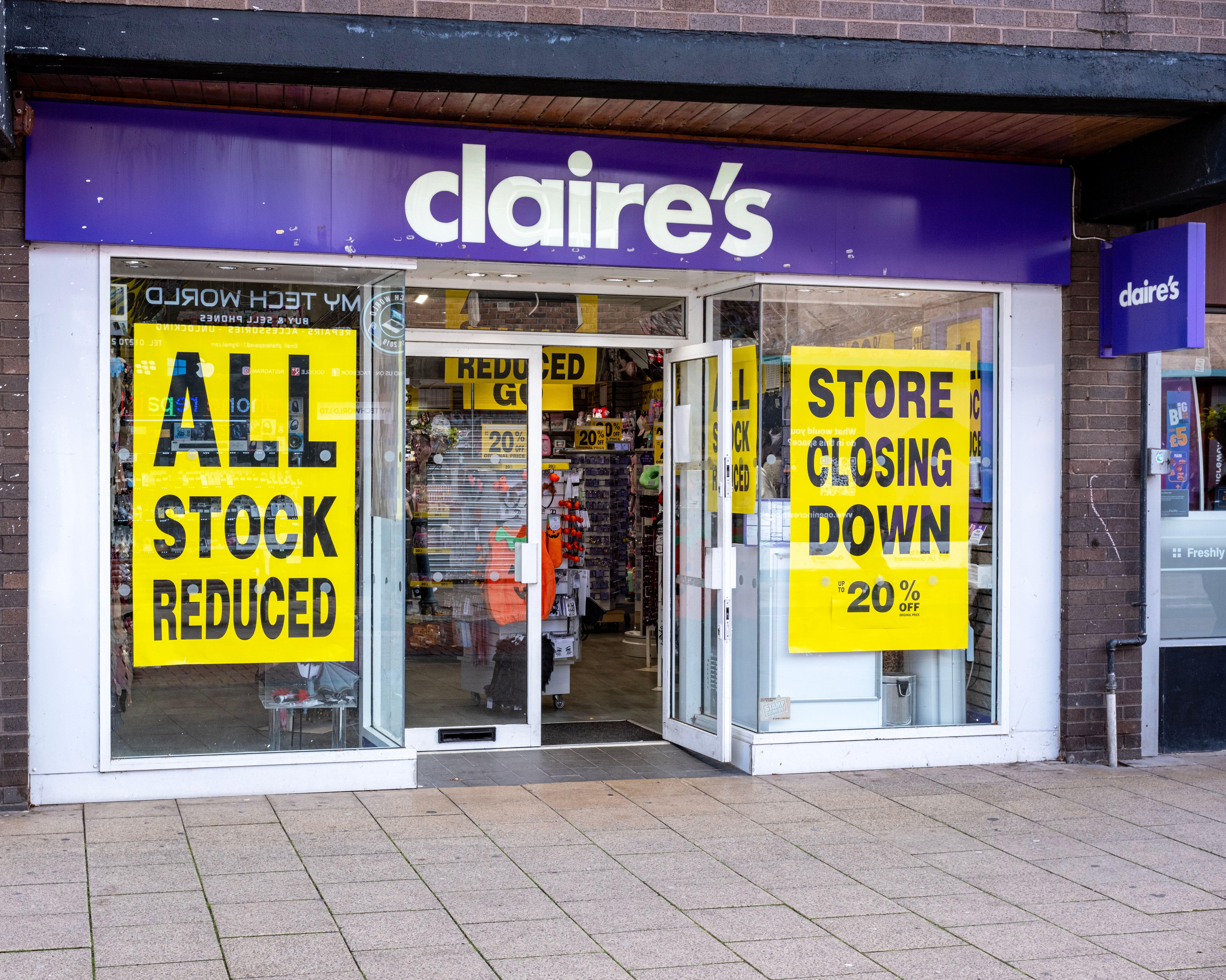 Claire's accessories shop in Crewe, UK, with signs saying "ALL STOCK REDUCED" and "STORE CLOSING DOWN 20% OFF".