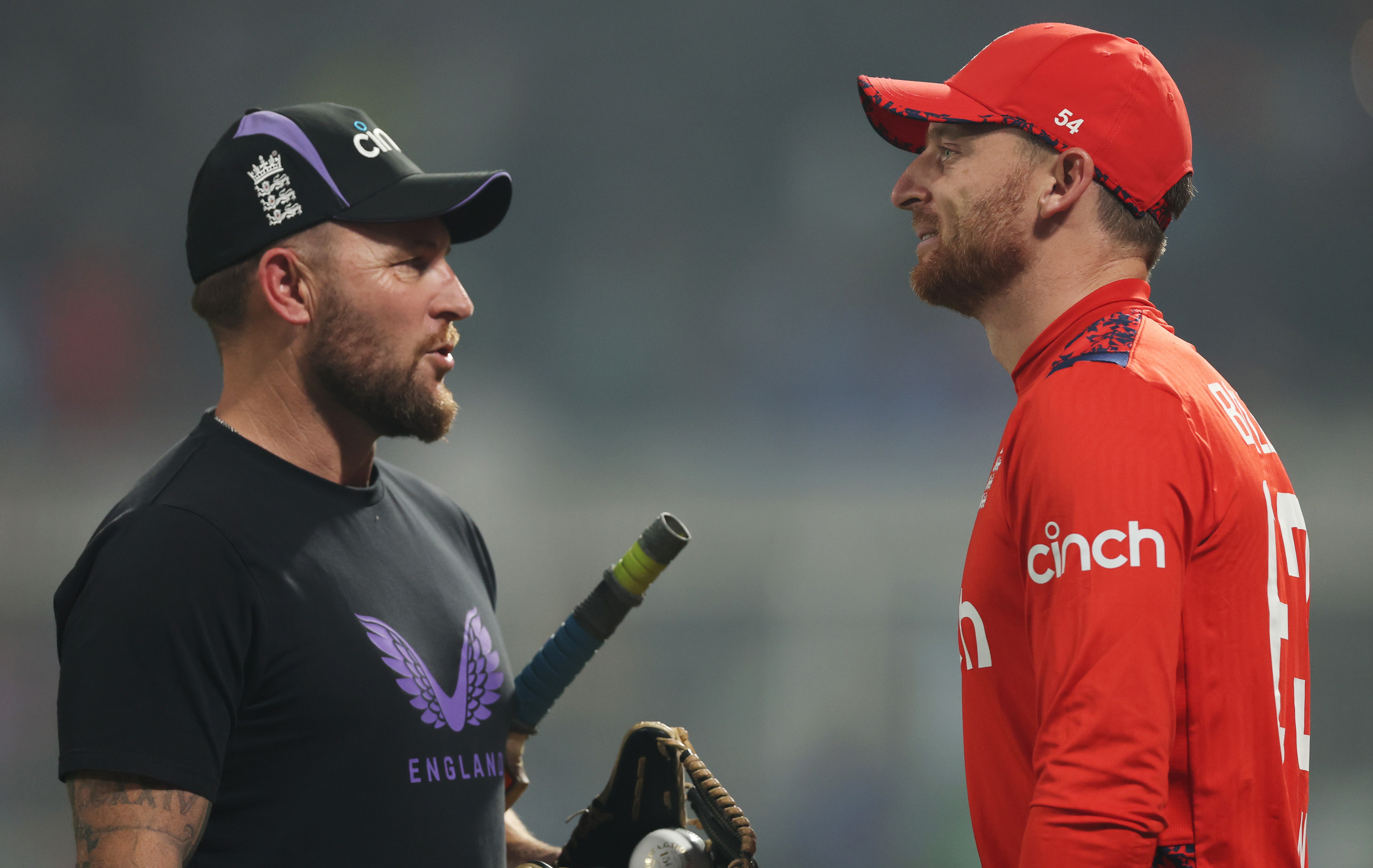 England Head Coach Brendon McCullum talks with player Jos Buttler during the T20 International match.