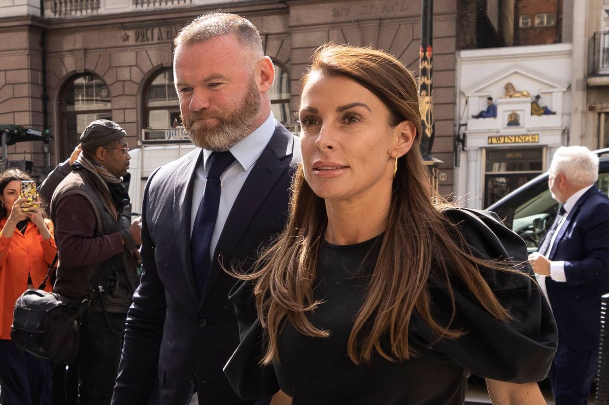 Coleen Rooney arrives with husband Wayne Rooney at Royal Courts of Justice, Strand on May 12, 2022 in London, England. Coleen Rooney, wife of Derby County manager and former England football player Wayne Rooney, and Rebekah Vardy, wife of Leicester City striker Jamie Vardy, are locked in a libel battle dubbed by the media as the "Wagatha Christie" trial