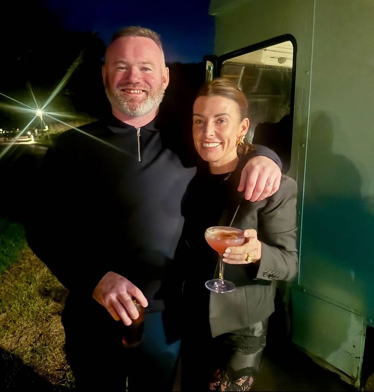 WAYNE AND COLEEN ROONEY sharing a drink together