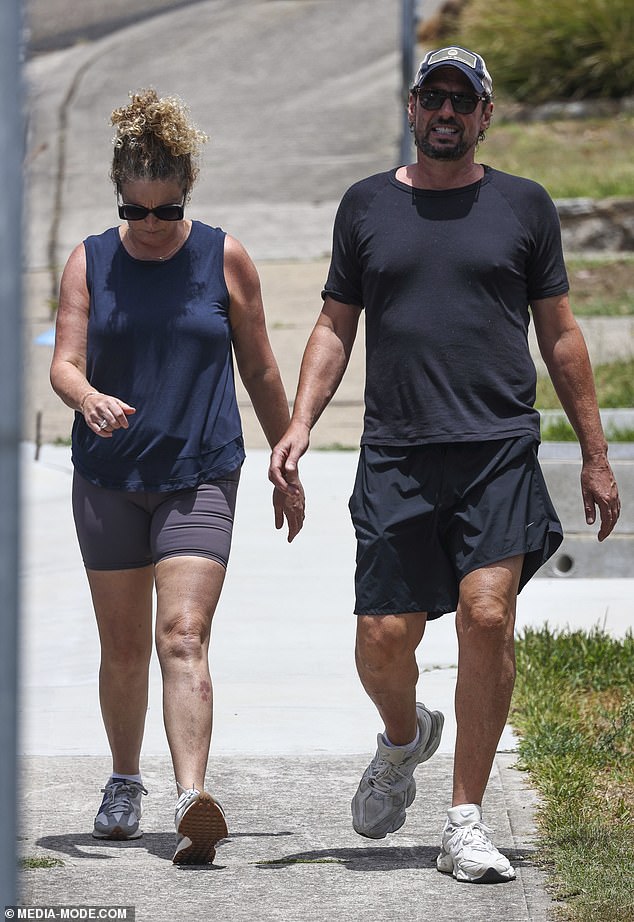 Fassnidge kept a low profile in a cap and sunglasses as he stepped out for a walk in Sydney with his wife Jane Hyland