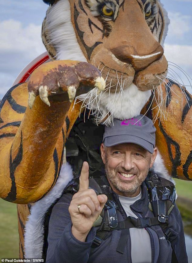 Paul Goldstein walking marathons in his tiger suit for charity