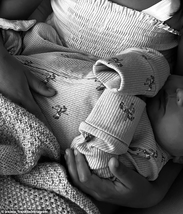 One photo showed the newborn resting peacefully with Jesinta, who lovingly held onto her baby