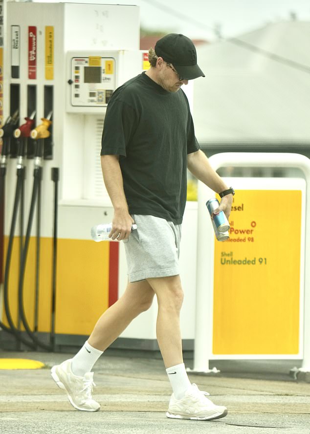 Ben Crosley has been spotted looking downcast in Brisbane (pictured) as his wife returned to the Glitter Strip