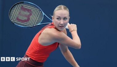 Anastasia Potapova swings a tennis racquet