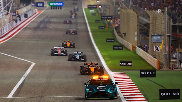 The FIA Safety Car leads Oscar Piastri driving the McLaren MCL39 Mercedes and the rest of the field during the F1 Grand Prix of Bahrain.