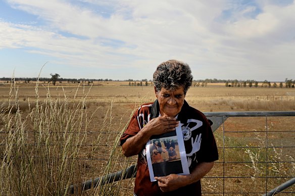 Aunty Frances Robinson at the site of the proposed incinerator with a photo of her Wiradjuri ancestors, which she carries everywhere she goes.