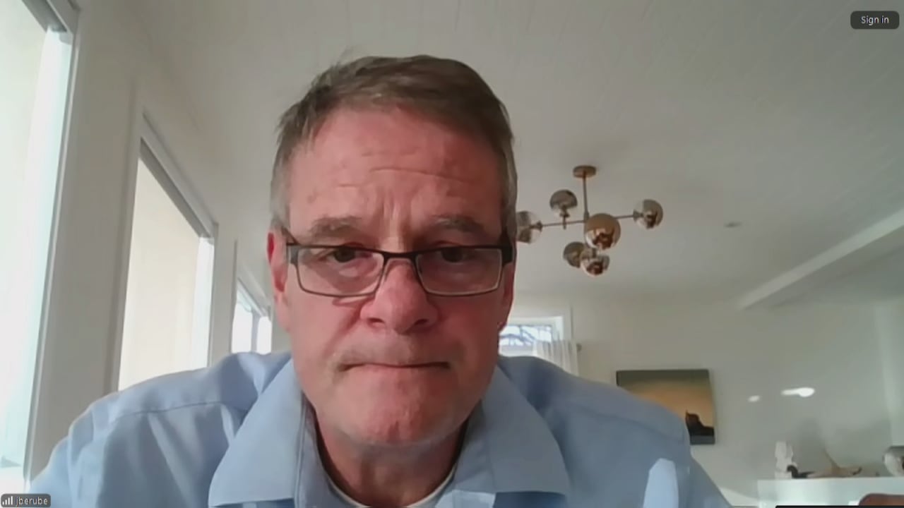 Man with blue shirt and glasses.