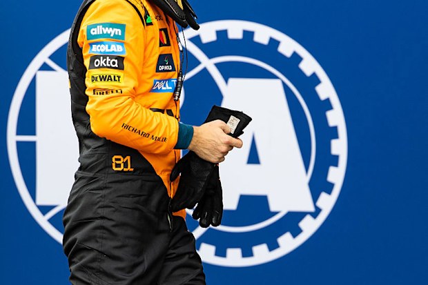 Oscar Piastri of Australia and McLaren exits the FIA garage.