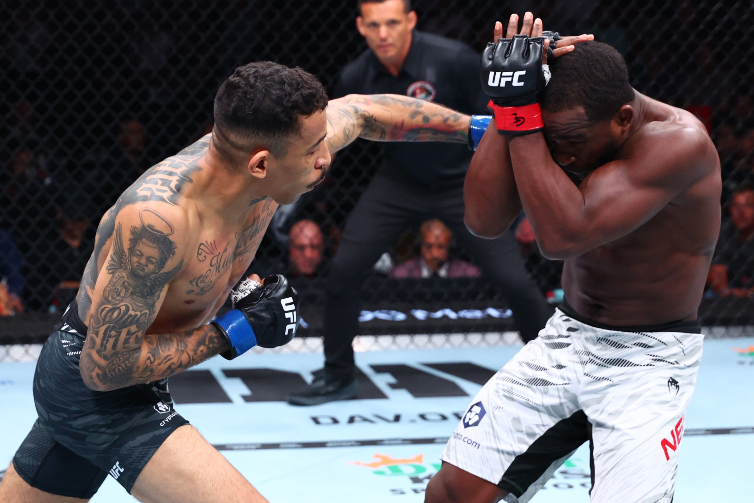 CHICAGO, ILLINOIS - AUGUST 16: (L-R) Carlos Prates of Brazil punches Geoff Neal in a welterweight fight during the UFC 319 event at the United Center on August 16, 2025 in Chicago, Illinois. (Photo by Ed Mulholland/Zuffa LLC)
