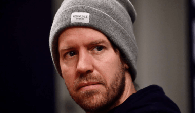 Vettel looking forward wearing a grey hat