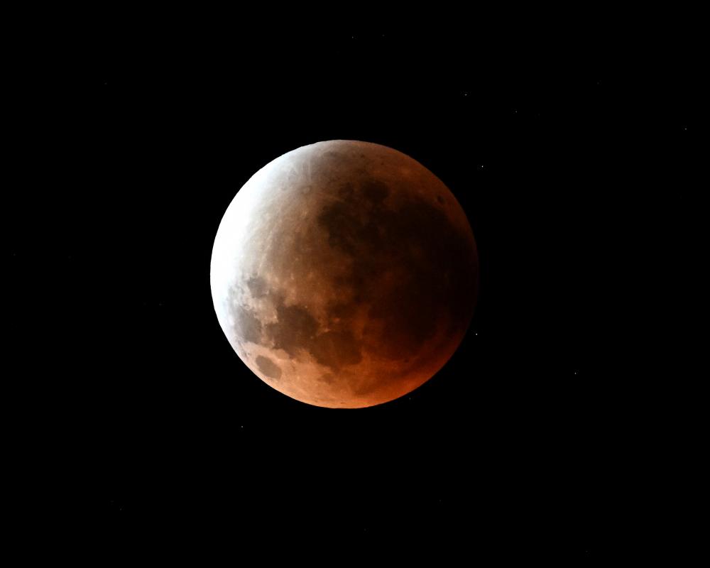 A full moon is seen over Sydney during a lunar eclipse on September 8, 2025. 
