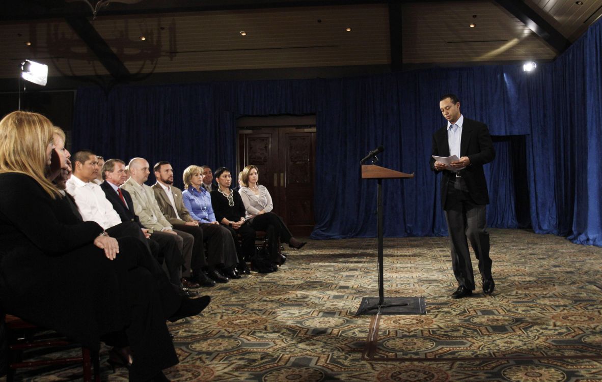 Woods approaches a lectern before giving a televised statement in February 2010. <a href=