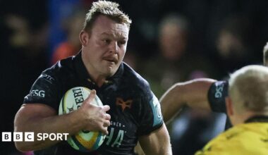 Ospreys' Dewi Lake runs with the ball in his right hand