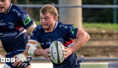 Hooker George Roberts runs with the ball for Doncaster Knights