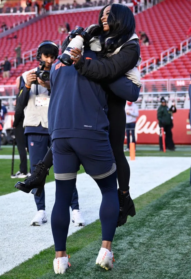 AP Photo/Eakin Howard Jonathan Owens and Simone Biles