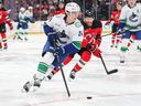 Zeev Buium #24 of the Vancouver Canucks skates with the puck during the second period of the NHL game against the New Jersey Devils at Prudential Center on December 14, 2025 in Newark, New Jersey. 