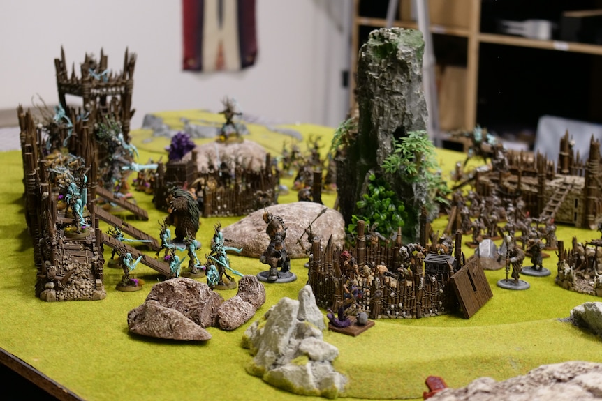 Miniature wargame models displayed on a green tabletop.