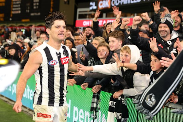 Collingwood forward Lachie Schultz celebrates with Magpies fans - the AFL’s biggest membership group.