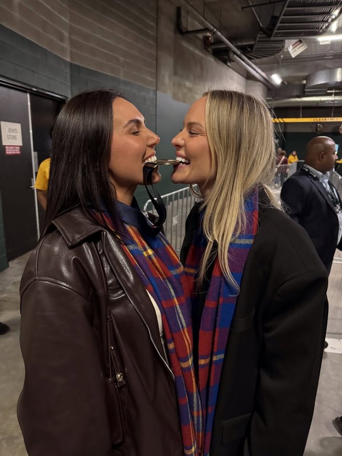 Jules Neale with Ms Crosley who has Lachie’s premiership medal around her neck. 