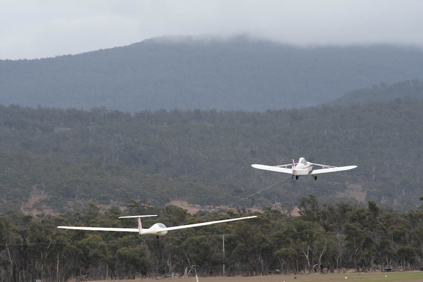 Glider being towed by aircraft during 'launch' phase.