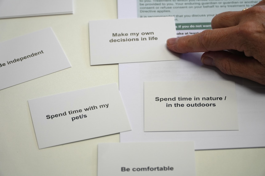 A series of small white cards with headings like 'make my own decisions' and 'spend time in outdoors'.