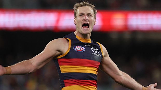 Jordan Dawson of the Crows celebrates a goal.