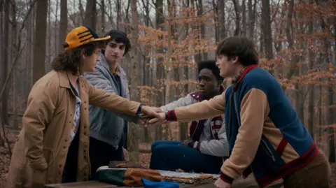 Netflix The four main characters meeting in a wood