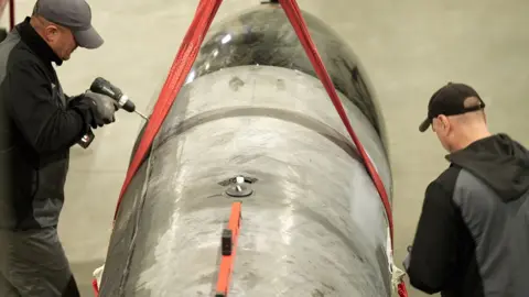 Moose Campbell/BBC two men build the new Flamingo missile which is a  long-range Ukrainian cruise missile, designed for deep strikes against Russia with a over a ton warhead and a range up to 3,000 km 