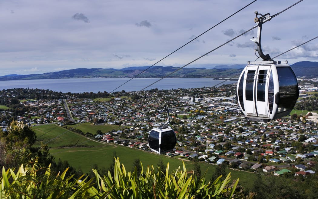 Riding cable car above Rotorua lake and city, in the centre of North Island of New Zealand
