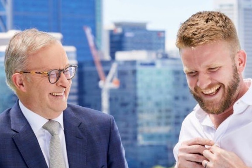 Anthony Albanese and Tim Picton are both smiling as they stand side by side.