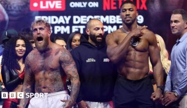 Anthony Joshua laughs as he faces off with Jake Paul