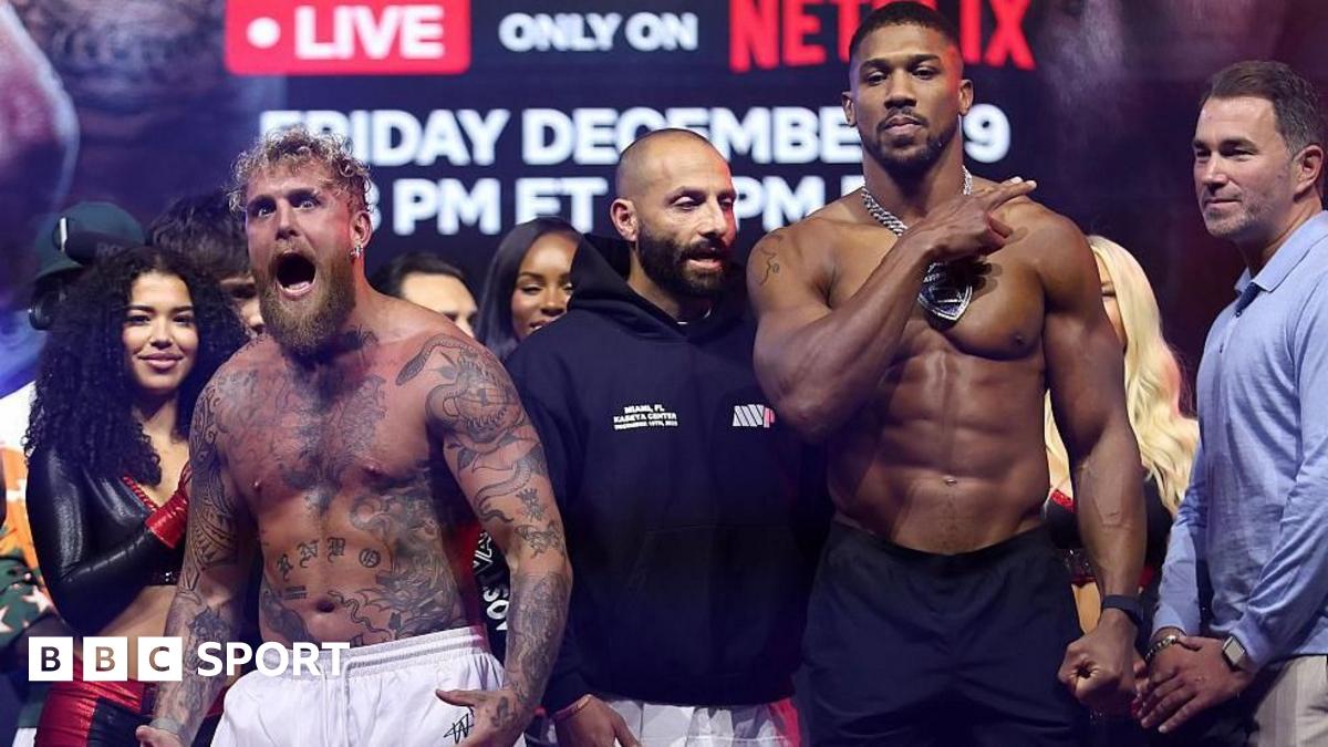 Anthony Joshua laughs as he faces off with Jake Paul