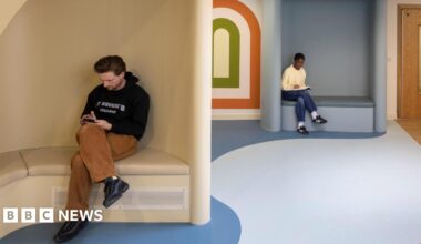 A design interpretation showing the interior of The Sett with two people sitting in booths.