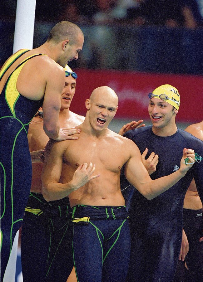 16 Sep 2000:  (L to R) Ashley Callus, Chris Fydler, Michael Klim and Ian Thorpe of Australia celebrate after winning Gold in the Mens 4 x 100m Freestyle Relay at the Sydney International Aquatic Centre during Day One of the Sydney 2000 Olympic Games in Sydney, Australia. They won the Gold in a World Record time of 3 mins 13.67 secs. Mandatory Credit: Al Bello /Allsport