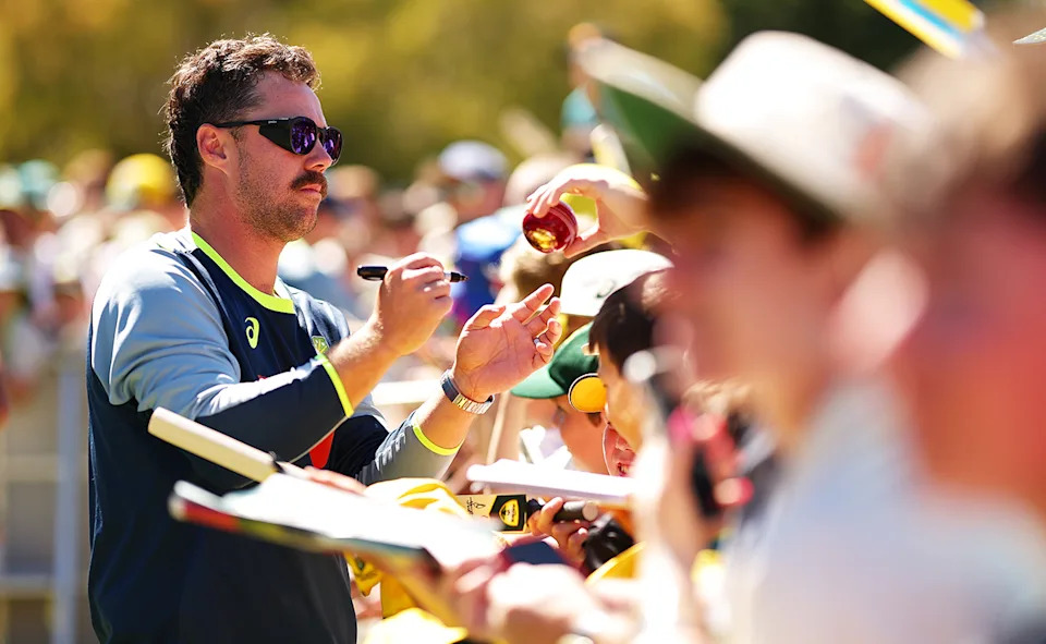 Travis Head, pictured here signing autographs for fans after the fourth Ashes Test at the MCG.