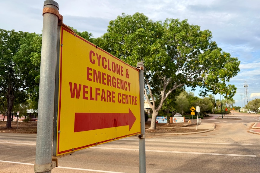 Yellow sign pointing to Cyclone and emergency welfare centre