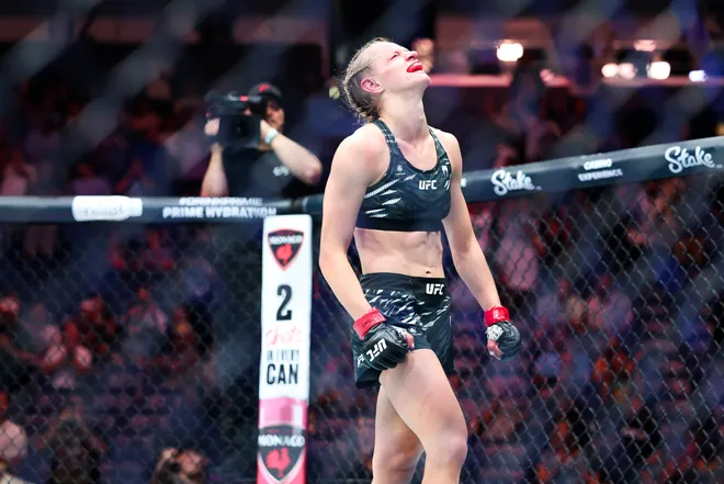 Jul 19, 2025; New Orleans, Louisiana, UNITED STATES; Carli Judice (red gloves) celebrates defeating Nicolle Caliari (blue gloves) during UFC 318 at Smoothie King Center. Mandatory Credit: Stephen Lew-Imagn Images