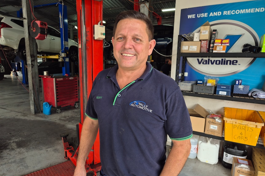 A man in a mechanic shop.