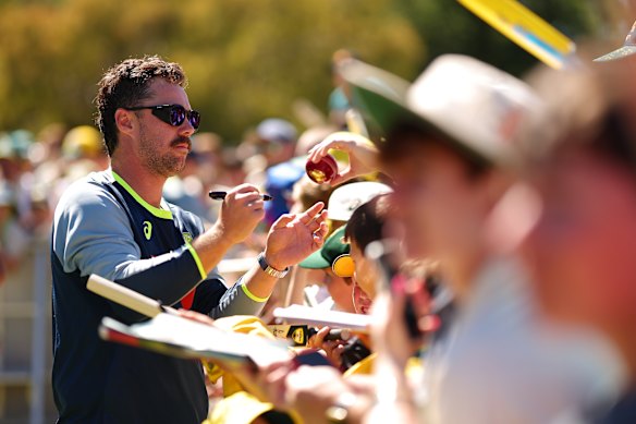 Travis Head, leading runscorer in the series, signs autographs on what should have been day three of the Boxing Day Test. 