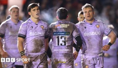 Gloucester players, wearing the Prem club's mauve away kit, react after being beaten 45-14 at Leicester Tigers
