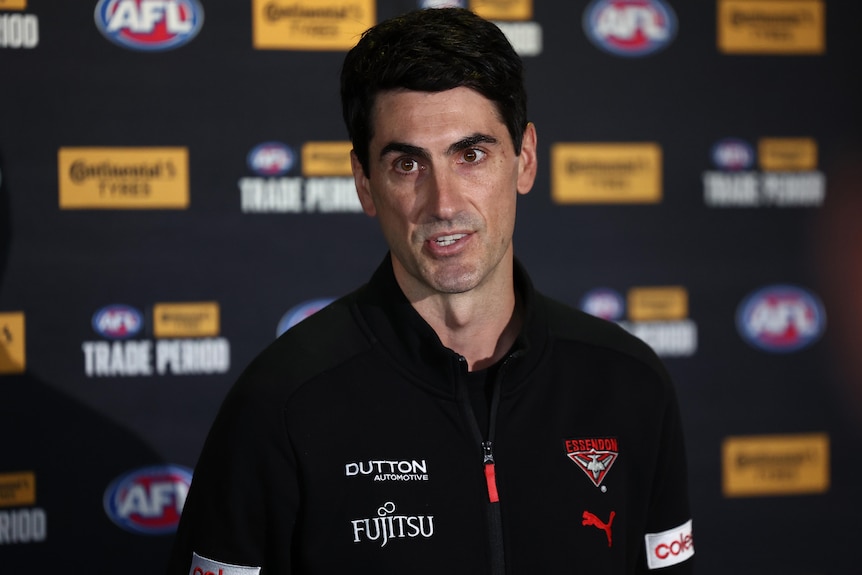 Essendon list manager Matt Rosa speaks at a press conference