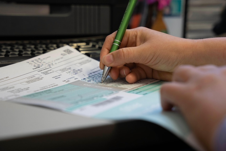 A doctor writing a prescription. 