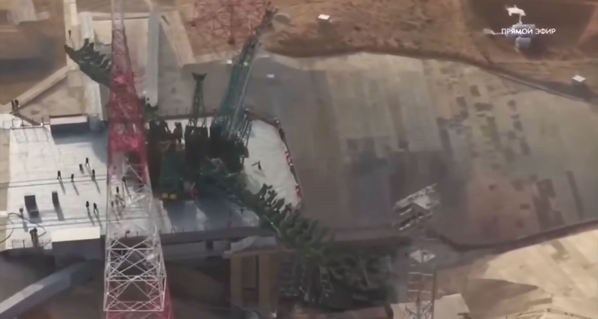 drone video still of a launch pad after a launch showing damage to the infrastructure at the base of the flame trench